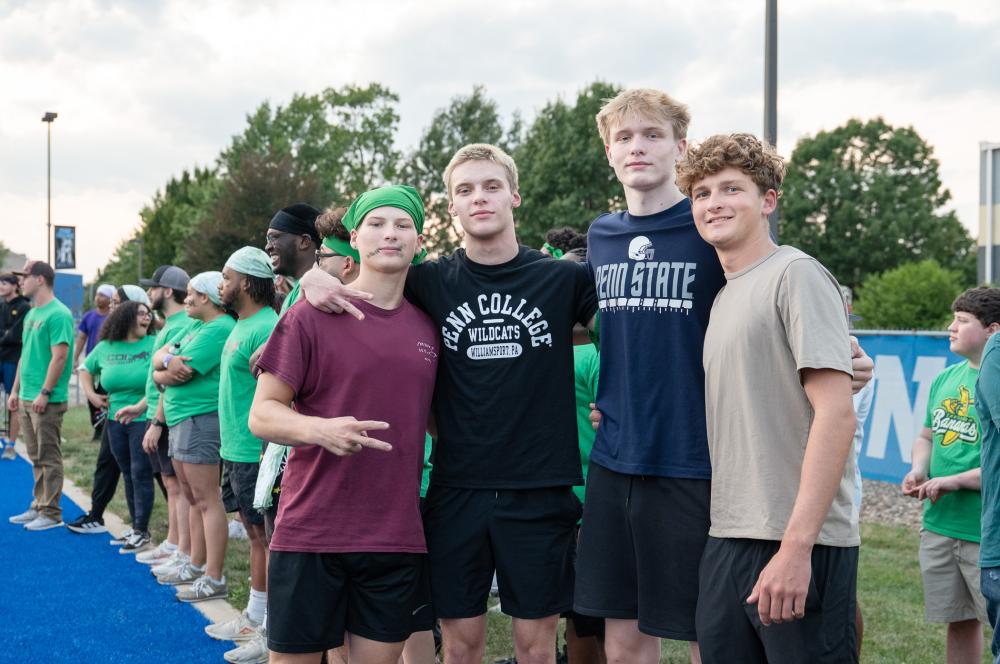 Four students at kickball game