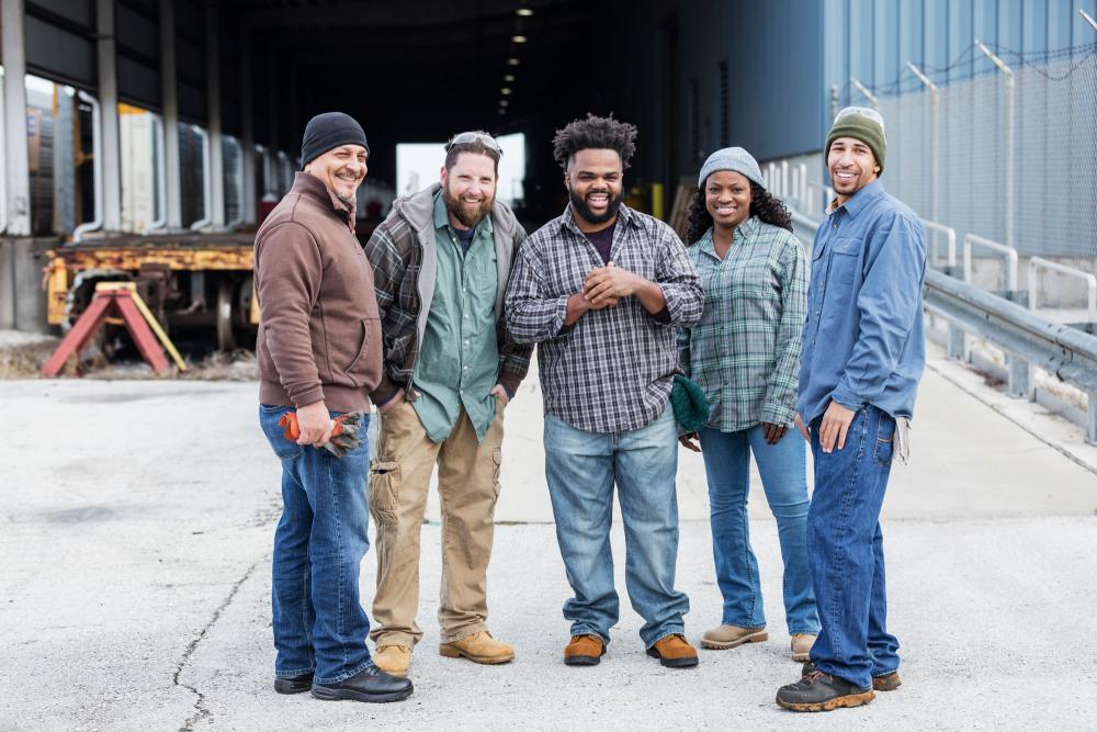 group of people standing outside a warehouse