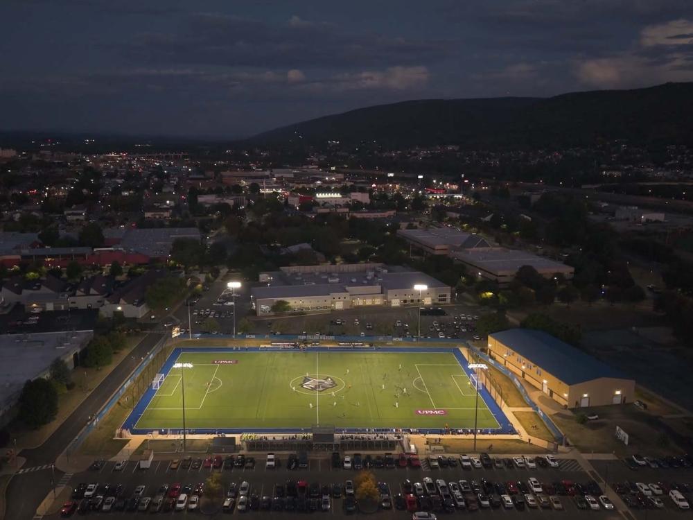 Aerial view of a soccer game in action after sunset on UPMC Field