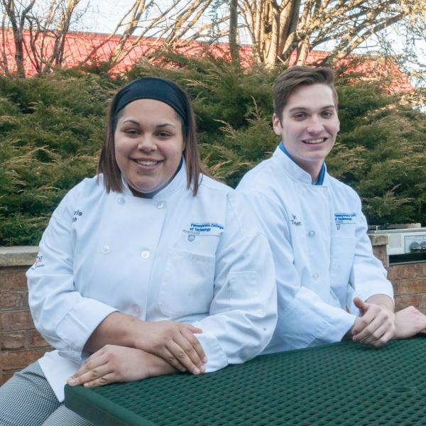 Penn College students Amaris Smith and Dylan Therrien work in a professional kitchen at Le Mas Candille hotel and spa during a culinary internship in Moujins, France.