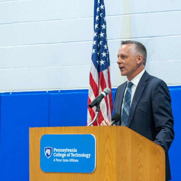 President Michael J. Reed, who served as a high school counselor and principal before becoming a college administrator, welcomes seminar participants to campus.