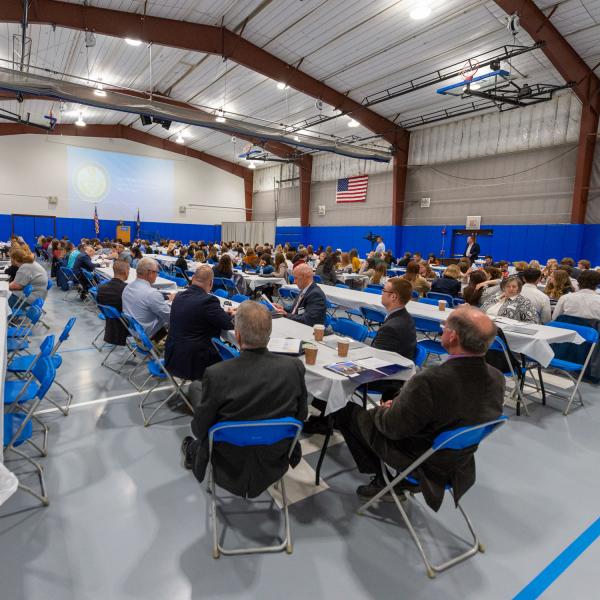 High school students gather with their teachers in the Field House before being dispersed into purposeful breakout sessions.