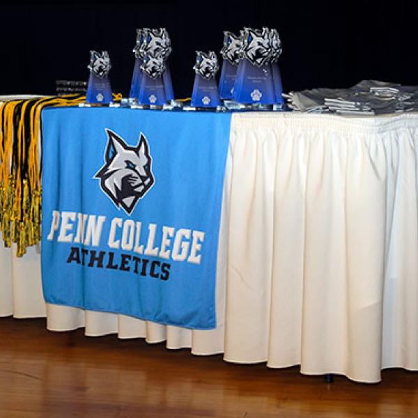 Awards, honor cords and student-athlete stoles lie ready for their deserving recipients.