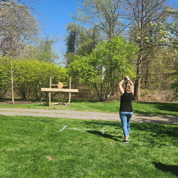 Alexandra M. Lehman, Workforce Development training consultant, takes aim at the axe-throwing venue.