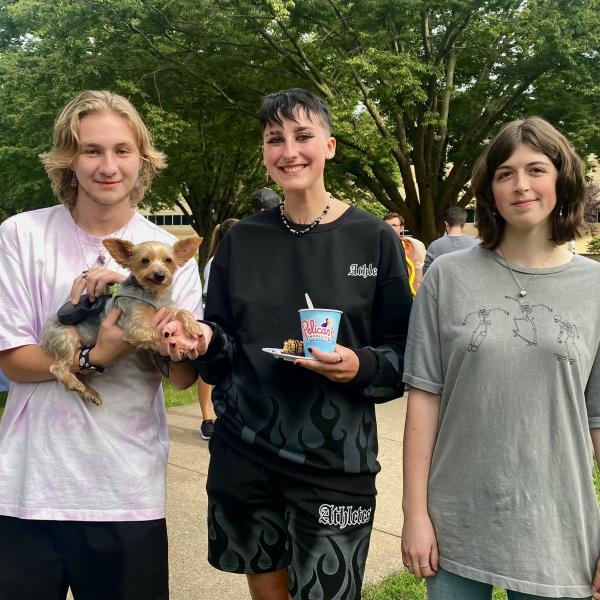 Making another return trip to the popular event (as well as making friends) is Lily, a Yorkshire terrier owned by Noelle B. Bloom, assistant director of dining services. From left are Brent R. Andrew, of Landisville, bachelor of architecture; Tessa L. Pavlova, Milroy, pre-surgical technology; and Lilah M. Husson, Coudersport, plastics & polymer engineering technology.