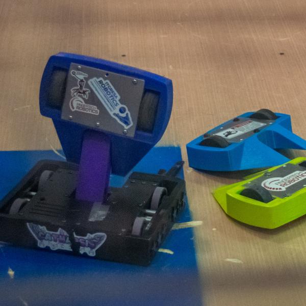  A trio of colorful mini-robots, teamed as "3 Despacitos"