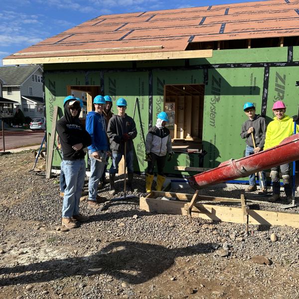 The crew in place, eagerly awaiting the flow of concrete down the chute