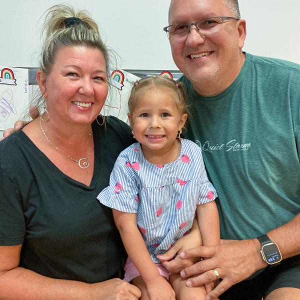 A child with a grandmother and grandfather.