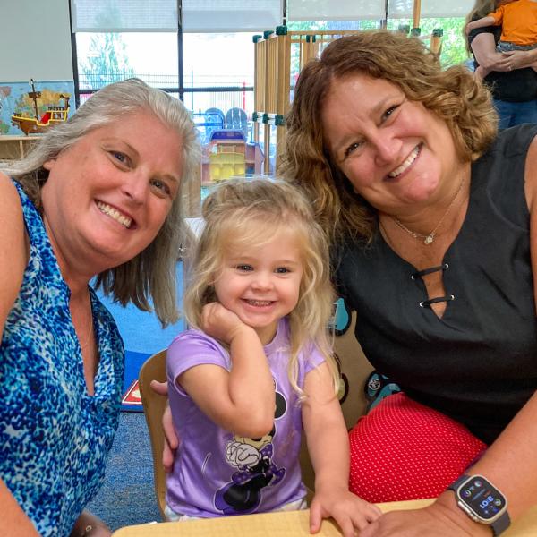 A child and two grandmothers.