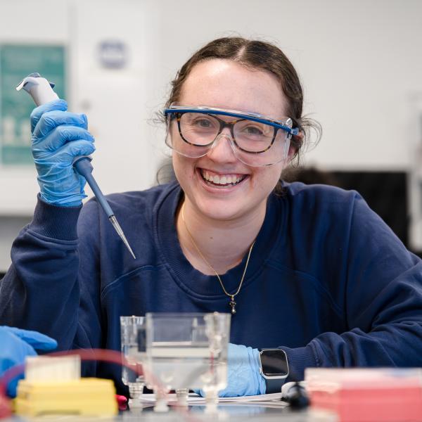biomedical science student in the lab with micropipette