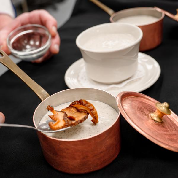 Chef Frank M. Suchwala garnishes his mushroom soup. 