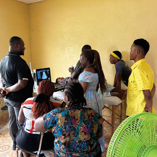 Medical professionals gain experience using ultrasound equipment at Nancy Fayia Medical Clinic in Liberia.