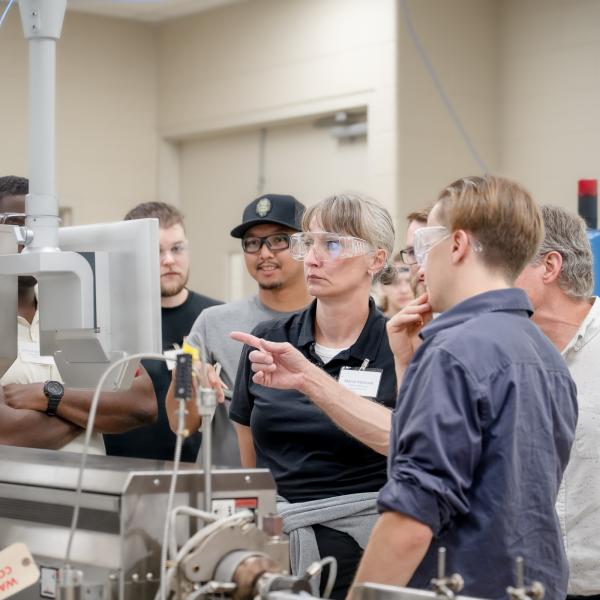students and instructor extrusion machine