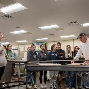 Chef Todd M. Keeley, assistant professor of baking and pastry arts/culinary, demonstrates one of the overs in the baking and pastry arts lab. The students were from Jersey Shore High School and Monroe Career & Technical Institute.