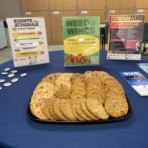 Signs promoting a variety of campus activities accompany the snacks.