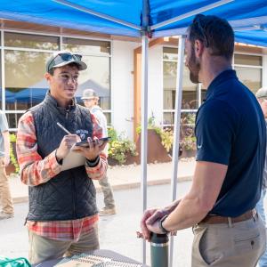 A student talks with an employer.