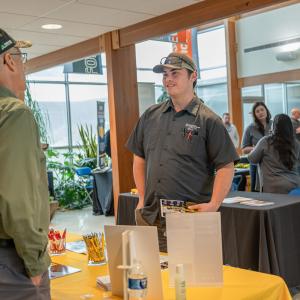 A student talks with an employer.