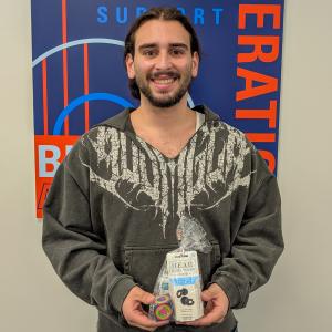 A student holds a package.