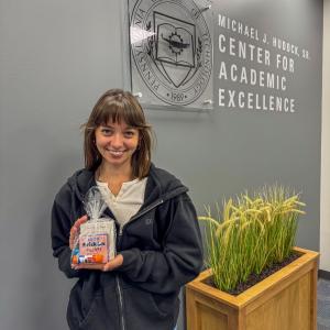 A student holds a package.
