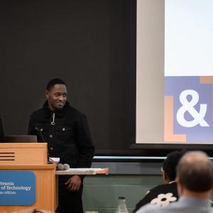 A man speaks into a microphone.