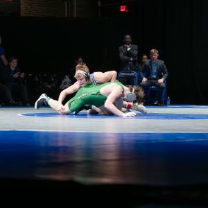 Carter Davis wrestles an opponent from York College on the Journey Bank Community Arts Center stage.