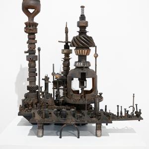 A metal sculpture by Paul Lehr. The sculpture is composed of metal scraps.