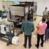 Christopher J. Gagliano, Plastics Innovation & Resource Center project manager, instructs workshop attendees in Pennsylvania College of Technology’s Thermoforming Center of Excellence. 