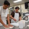 two students in baking lab