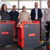 Representatives of Penn College and Fronius USA with Fronius power sources.
