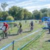 Bicyclists follow a trail around the pond at Penn College's Schneebeli Earth Science Center.
