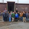 Penn College students stand in front of a large steel girder at High Steel Structures LLC in Williamsport.