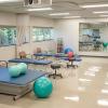A room equipped with exercise and physical therapy equipment.