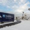 Snow-covered landscape at the Pennsylvania College of Technology main entrance.