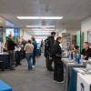 Information tables line a hallway in Penn College's Hager LIfelong Education Center.