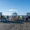 Penn College students gather around heavy equipment at the college's traning site.