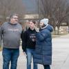 A family stops for directions on the college's mall.