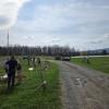 Students plant trees along a path at Penn College's Schneebelie Earth Scence Center.