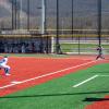 Looking down third-base line as Penn College softball pitcher strikes out Penn State Abington batter at Williamsport Lumber Yards.