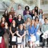 A group of students stands on the stairs of Penn College's Davie Jane Gilmour Center.