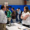 Students talk with employers in Penn College's Field House.