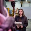 Natalie A. Greiner operates a Motoman robotic welding cell in Penn College’s Lycoming Engines Metal Trades Center.