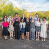 A group of high school students in dressy clothes poses on a patio outside of Penn College's Thompson Professional Development Center.