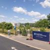 Pennsylvania College of Technology's main entrance, showing a large blue "Pennsylvania College of Technology" sign, a large U.S. flag and the Davie Jane Gilmour Center.
