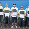 Five of 49 apprentices show off their completion certificates at Penn College. 