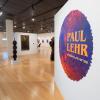 Sculptures and paintings are displayed in The Gallery at Penn College. A large wall graphic says "Paul Lehr: A hidden universe."