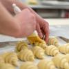 A Pennsylvania College of Technology student brushes a croissant with an egg wash before baking. The college recently celebrated the graduation of seven incarcerated students at State Correctional Institute Muncy who completed the college’s American Culinary Federation-accredited professional baking certificate. The certificate was offered at SCI Muncy through the college’s Prison-to-College program.