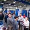 Students interact with employers in Penn College's Bardo Gymnasium during a Career Fair.