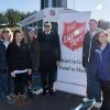 At the Nov. 12 5K run/walk held at Williamsport Area High School, some of the students enrolled in Penn College’s Community and Organizational Change course gather with Major Donald Spencer (center), director of the Salvation Army of Williamsport. 