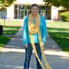 Elaina G. Stone, a general studies student from Williamsport, stands on the campus mall, adorned in a hand-knit "candy corn" scarf, in this photo from the One College Family blog.