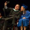 Faculty onlookers share in the joy of the class speaker's splendid day, captured with the help of chief student affairs officer Elliott Strickland.